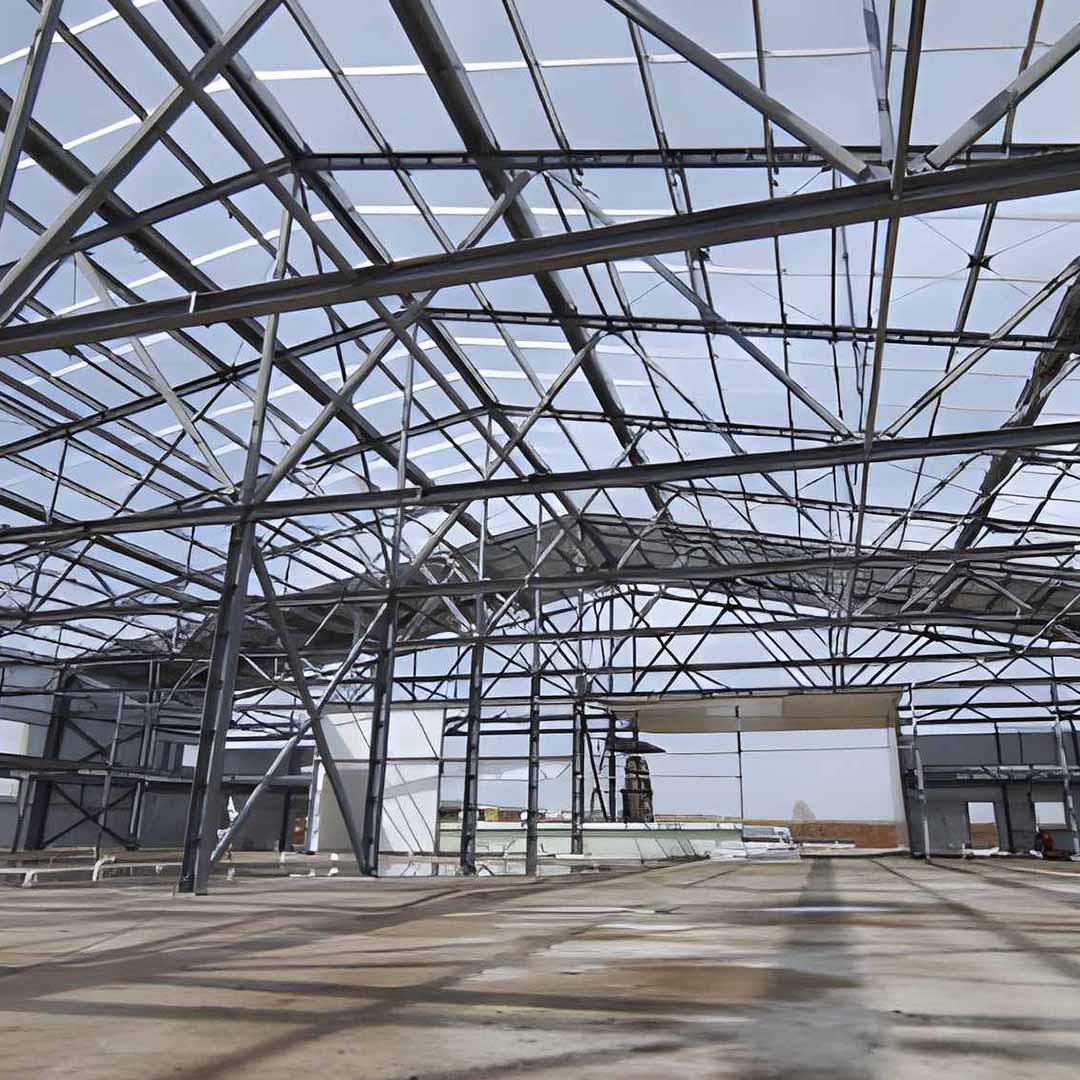 Close-up of structural steel connection details in a Doha warehouse project, reflecting engineering standards from Turkey and United Arab Emirates.
